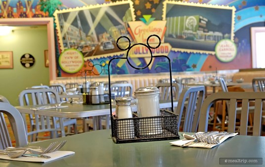 Cute Mickey shaped condiment baskets are on each table.
