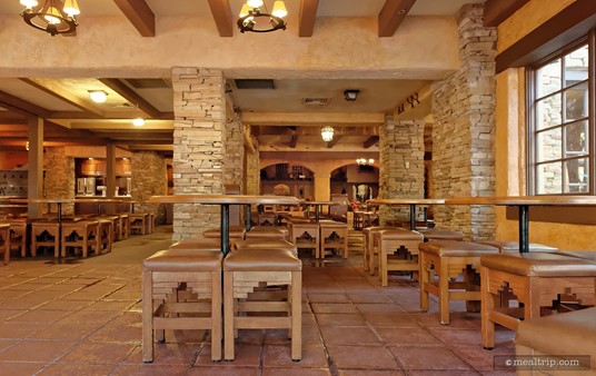 There are no backs on the chairs at Pecos Bill's Cafe. The Western stool design is part of the decor.