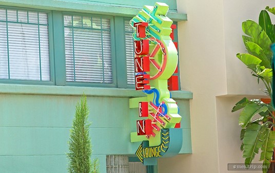 The "Tune-In Lounge" sign at Hollywood Studios might just be the single 
most difficult restaurant sign to take a photo of in all four of 
Disney's Central Florida parks.