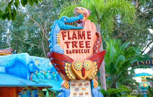 This sign in front of the Flame Tree Barbecue also serves as a two-sided menu board.