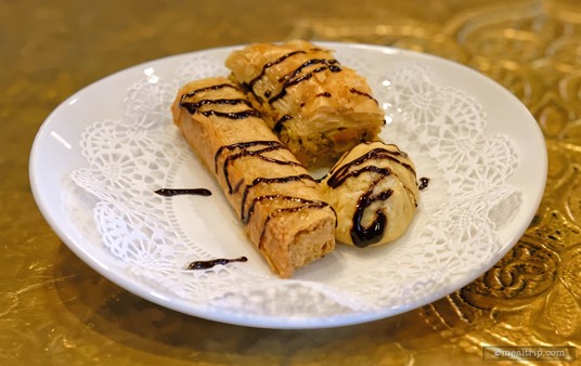 The Baklava Sample Plate contained three small baklava. One was almond based, one was pistachio, and the third was walnut. They were drizzled with chocolate, but lacked the oozy syrup that you find in larger portions. (Fall, 2018)