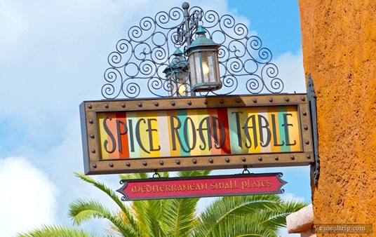 The Spice Road Table sign hangs over the entrance of this restaurant in the Moroccan pavilion at Epcot.