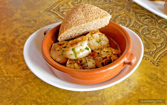 The Spicy Shrimp plate from The Spice Road includes 
Sautéed Shrimp with Dried Chilies and Fried Garlic, along with a small 
portion of bread.  (2016)