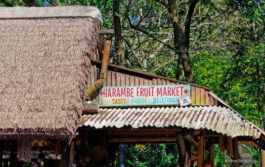 The very detailed sign and straw roof above the Harambe Fruit Market.