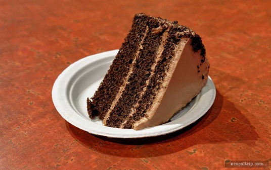 The Chocolate Cake has changed a bit over the years. The previous version featured the same three layer chocolate cake format, but featured a dark chocolate fudge-like icing that held the cake together — rather than the "milk chocolate" frosting on the current iteration.