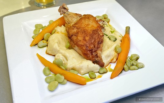 From the Land section of the menu, the Stuffed Chicken entree. The chicken is stuffed with copped spinach, herbs, and cream cheese. The dish is accompanied with cheesy polenta and seasonal vegetables.