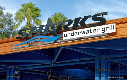 The main location sign over the entrance of Sharks Underwater Grill.