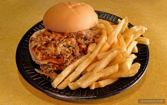 The Spice Mill's Pulled Pork Sandwich Platter is served with French Fries.