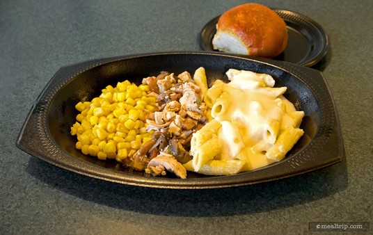 Chicken and mushroom hash with penne and alfredo corn and a warm dinner roll.