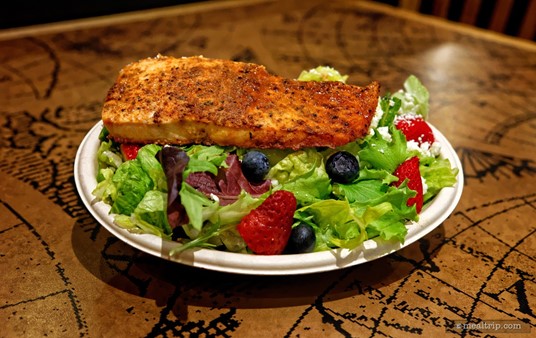 The BBQ Salmon Salad at Voyager's Smokehouse features an rub-style bbq salmon (served chilled) blueberries, strawberries, feta cheese, walnuts and a raspberry vinaigrette dressing