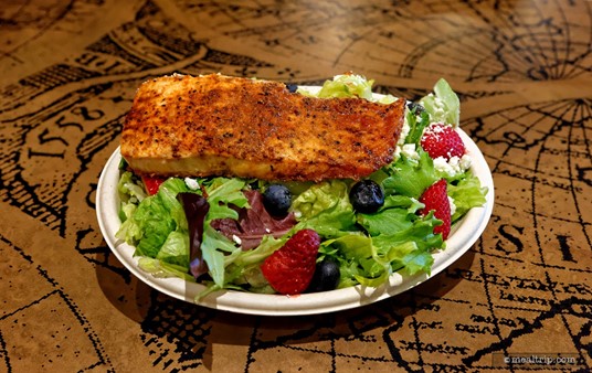 The BBQ Salmon Salad at Voyager's Smokehouse is $21.99 (as of early Summer 2024). SeaWorld is also adding a "surcharge" to every order, making the price a little higher. If you're going to eat two or more meals at SeaWorld, the All Day Dining program is worth looking into.