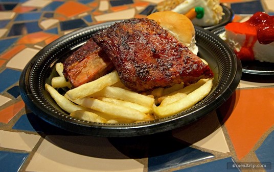 Voyager's Barbecue Sparerib Platter with fries and a dinner roll.