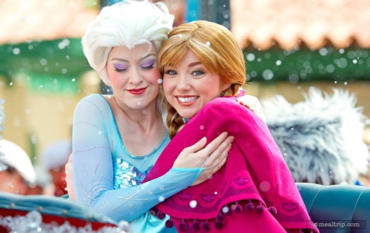 The Frozen Dessert Party is part of the Frozen Summer Fun Premium Package and includes reserved
 "royal viewing" for the mini-parade earlier in the day. Here, Anna has 
spotted my giant lens, while Elsa seems more interested in a hug.