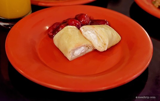 Cheese Blintz (cut in half so you can see the cheese) with Cherry Topping.