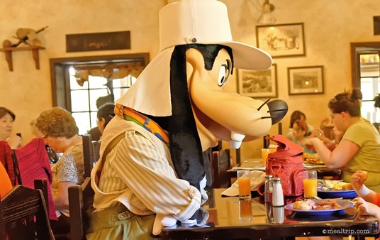 Safari Goofy sits down for a bite to eat during the Tusker House character breakfast.