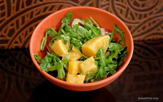 This might be Tusker House's "Trek Power Salad"? No matter... Tusker House usually has a couple pre-made cold salads on the buffet line... that aren't super complex. There's some Arugula and Mango in this item... maybe some onions too... and very lightly dressed in... something.