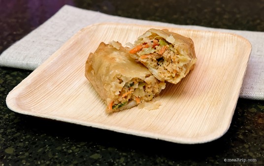A Kung Pao Chicken Egg Roll cut in half (because egg rolls don't look like much on the outside). One comes with the lucky combo (along with other stuff), or you can get two of these as a single plated snack.