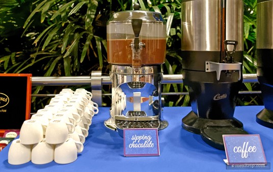 The sipping chocolate is on the coffee cart, and small cups are lined up next to it. The chocolate beverage is not "quite" as thick as proper drinking chocolate, but instead is a slightly thick (I assume dairy-based) hot chocolate type of drink. It makes a great "dip" for dunking your desserts into as well.