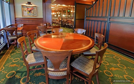 This round table is set for seven guests in one of the Turf Club's overlook type of dining areas. In this case, it "overlooks", the patio dining area.