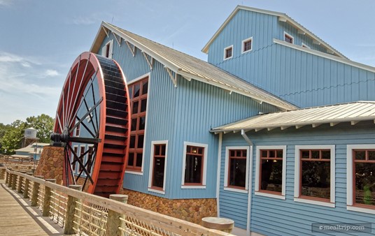 Here's a great photo of the paddle wheel outside. The wheel is an important part of how a mill works. Water pushes the wheel and turns a larger axle inside the dining area.