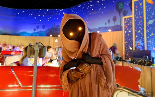 Awe... hey little guy. Jawas are walking around looking for things to trade. If you have a (non-valuable) object with you (the restaurant's silverware doesn't count), you can trade it with the Jawas. They really like shiny things.