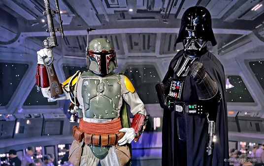 Darth Vader and Boba Fett pose for photos with guests before entering 
the main dining area at the Star Wars Dine-In Galactic Breakfast.