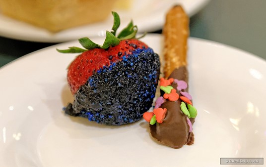Chocolate dipped strawberry, re-dipped in blue sugar and a chocolate dipped pretzel stick.