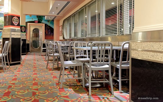 There are two "window" areas on each side of the restaurant that offer "chair" style seating with no booths. The booths, are located more in the location's interior space.