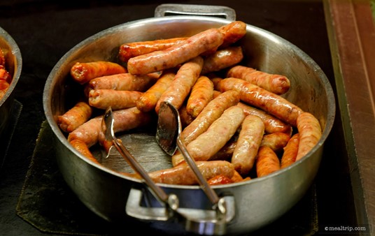A whole keep warm tray of breakfast sausages on the Crystal Palace buffet.