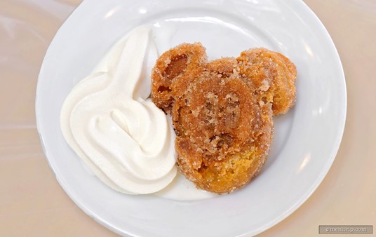 Oh Mickey, what happened to your head? It's okay... this is a deep fried Mickey Waffle that's been coasted in cinnamon and sugar. I've paired it with vanilla soft serve ice cream – because it seemed like the right thing to do.