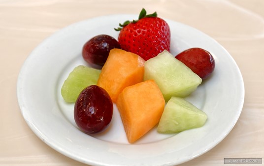 Here's some of the Mixed Fruit you'll find at the Crystal Palace breakfast buffet (and a strawberry, these are in their own bowl on the buffet line).