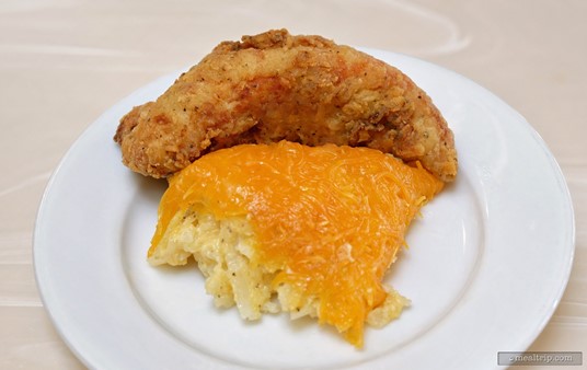I know, it looks like an odd slice of pie. The top item is a Crispy Fried Chicken and the bottom item is a portion of the Cheese Potato Casserole. The casserole is served on the buffet line in a not too deep pan... so in one spoonful you can carve out a nice slice of potato hash with all that baked cheese on the top.