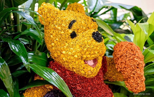 Here's a closer look at the Winnie the Pooh topiary in the center of the Crystal Palace. He's got a handful of honey!