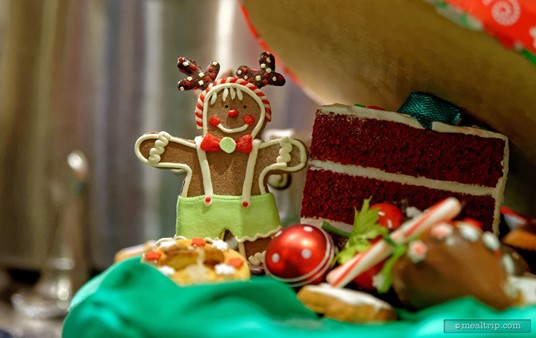 There are many small details around the dessert station. Under a giant cake centerpiece, you'll find this tiny, festive looking gingerbread man! He's for display only, and is not to be eaten.