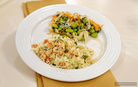 On the front of the plate, a Moroccan Couscous Salad.