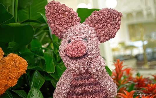 Hey Piglet! From the angle, you can see the buffet area in the background. These topiaries are located in the center atrium area at the Crystal Palace.