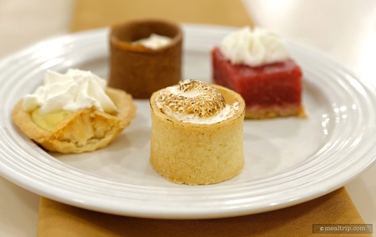 Front and center on this plate is a Banana Cream Pie (in a tiny edible cookie cup).