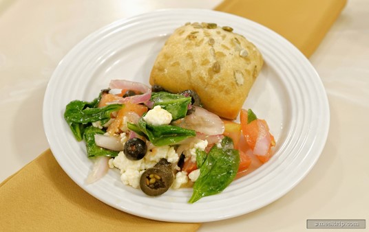 On the front of the plate is a Greek-style Tomato Salad from the Crystal Palace. There were a few more tomatoes than what are pictured here, but I wanted to show what else is in the mix... there's some black olives, feta, onion, herbs, and leafy greens... which make it "Greek-style".