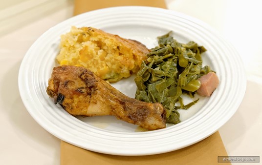 Here's an Americana Southern Favorites plate! Starting from the front and going clockwise — a Oven-Roasted Chicken Leg, Fire-Roasted Corn Spoon Bread, and Collards and Ham!