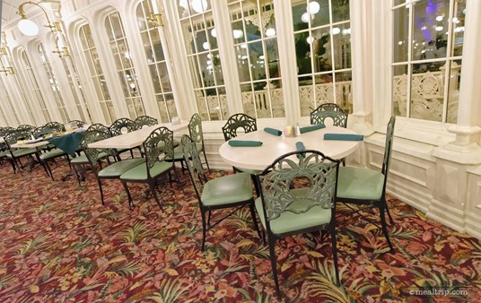 Here's a look at a table that's set, and ready for guests. Most of the tables at the Crystal Palace have wrought iron chairs, while a few offer partial bench style seating.