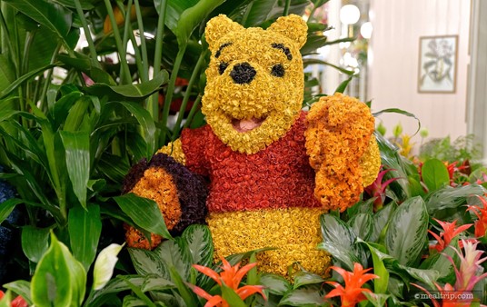 This Winnie the Pooh topiary, is located in the center atrium display area at the Crystal Palace Restaurant — Eeyore and Winnie are on the east side of the large circle of plants (or the left side, if you're walking in through the front door).