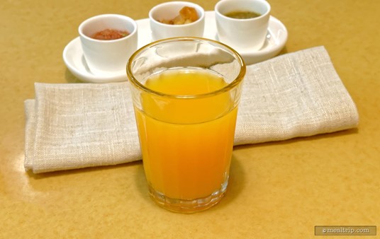 The "signature beverage" during the Garden Grill's breakfast period is a juice blend that combines orange, passion fruit, and guava juice.