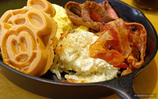 In the center of the photo (between the Mickey waffles and the bacon) is the Cheesy Potato Casserole.