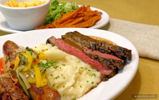 Moving down the plate, there are some Buttermilk Mashed Potatoes and then slices of Marinated Flank Steak. Recently, we've seen Pot Roast replacing the steak slices... but that's what a seasonally inspired menu is all about. 