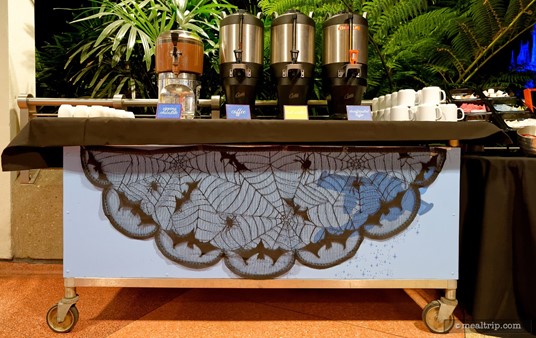 The hot beverage station at the Happy HalloWishes Dessert Party has been decorated with a bat net!