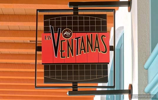 This square Las Ventanas sign hangs over the restaurant's entrance and is visible from the main walkway corridor. Las Ventanas itself is down a hallway off the main corridor, just past the Rix Lounge.