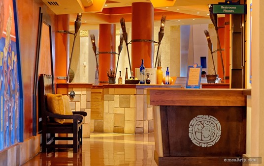 The check-in desk at Maya Grill is located in a long hallway, before you get into the main seating area.