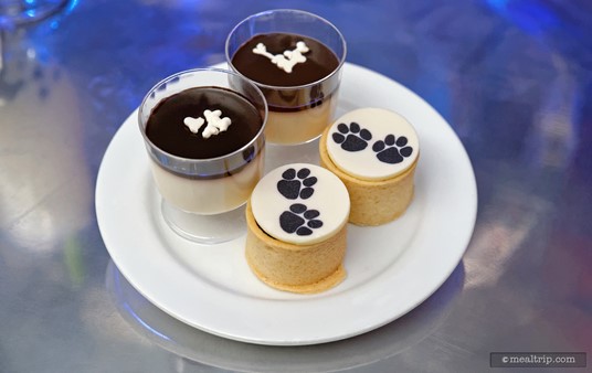 White Panna Cotta with Black Chocolate Sauce and Mini White Dog Bones and a Chocolate Tart with Paw Print Coin from the Cruella De Vil dessert station.