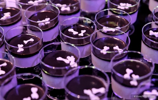 Cruella De Vil's "White" Panna Cotta with Black Chocolate Sauce and Mini White Dog Bones is actually white... to say there were a lot of purple lights in the room... would be an understatement!