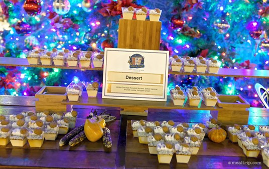 The prepared dessert station at the 2015 Holiday Harbor Nights featured a White Chocolate Pumpkin Mousse with Salted Caramel, Amoretti Cookie and Whipped Cream.